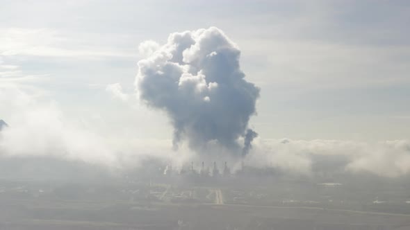 Coal-fired power plants that steam into the atmosphere.