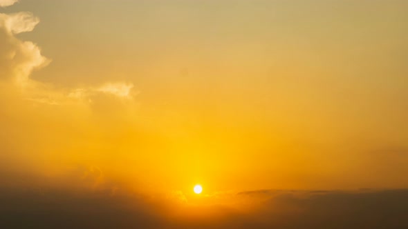 Time lapse sunset sunrise and beautiful twilight fluffy storm cloudy blue and yellow sky alt