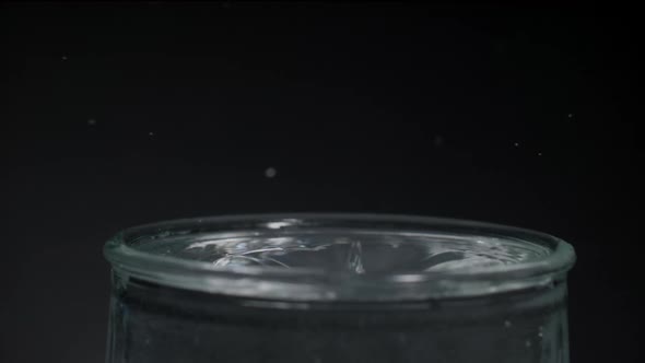 Water Droplet on a Glass of Water and Ripple Effect alt
