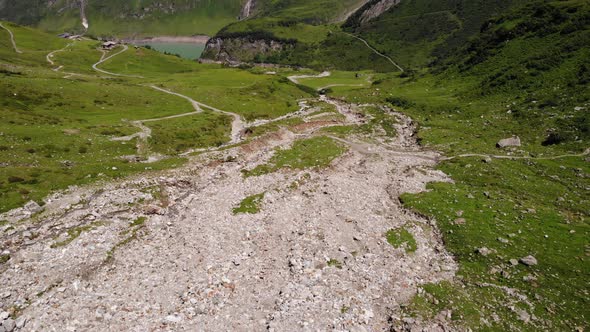 Blue Water At Stausee Wasserfallboden Surrounded With Green Landscape At Kaprun, Austria. aerial alt