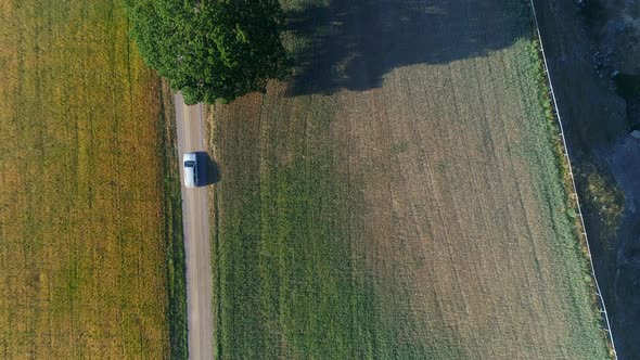 Aerial View of Car Driving on Country Road