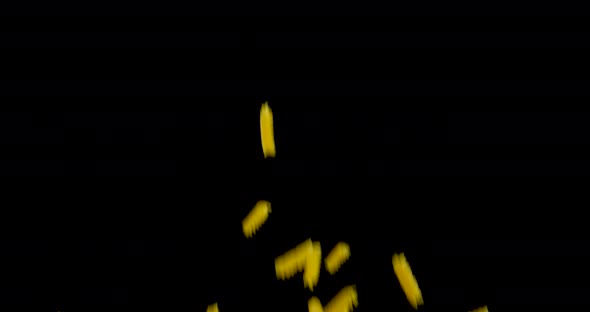 Italian Pasta flying in front of black background