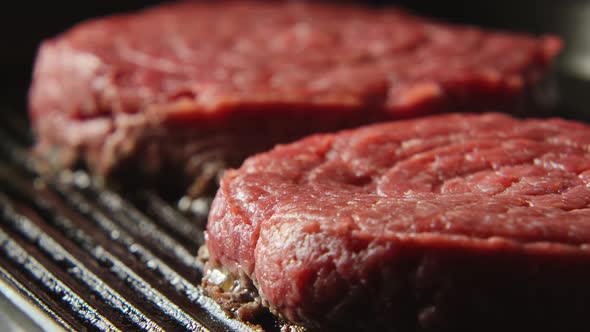 A blood beefsteak on a grill