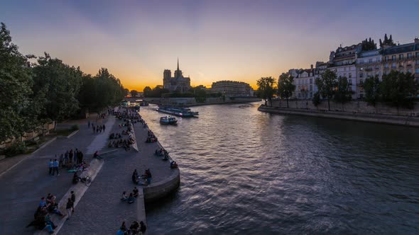 Rear View of Notre Dame De Paris Cathedral Day To Night Timelapse After Sunset alt