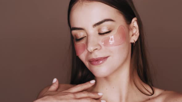 Facial Skincare Female Face with Pink Eye Patches alt