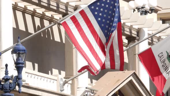 Flags of California and United States Waving on Flagpole in Gaslamp, Center Quarter of San Diego