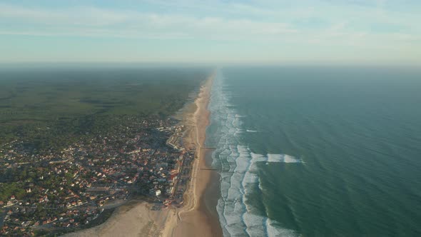 Small Beach Town Village Lacanau in France at Sunset, Aerial Establishing Wide Shot Forward with alt