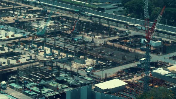 Large Construction Site with Heavy Construction Machinery in Metropolis alt