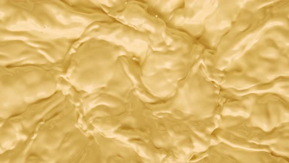 Super Slow Motion Shot of Swirling Yellow Milky Wortex at 1000Fps alt