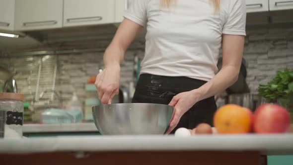 Crop Anonymous Woman Whisking Dough in Bowl in Kitchen