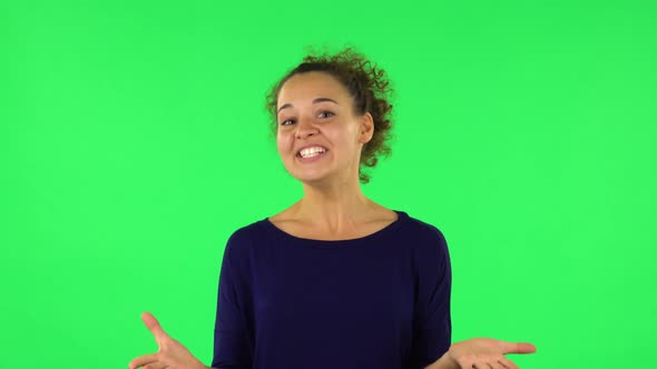 Portrait of Curly Woman with Shocked Wow Face Expression. Green Screen alt