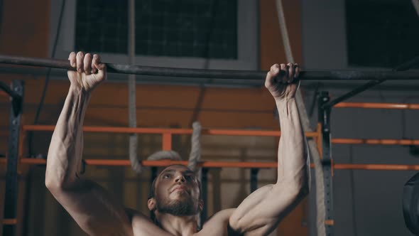 Athletic Man Doing Pull Ups alt