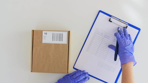 Hands Giving Parcel Box to Customer Signing Papers alt