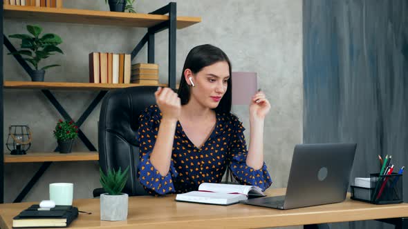 Woman in home office study online video conference call laptop webcam tutor, tells listen teacher alt