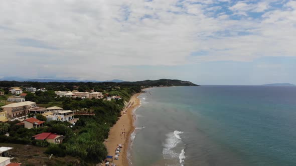 Aerial footage of the beautiful small town known as St George South in the city of Corfu Greece alt