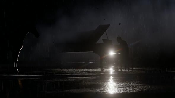 Man Playing the Piano While It Is Pouring Rain