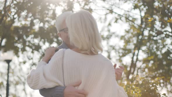 Senior Happy Couple Dancing Together in Autumn Park alt