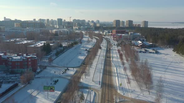 Winter Cityscape with Cars on Avenue and Apartment Buildings alt