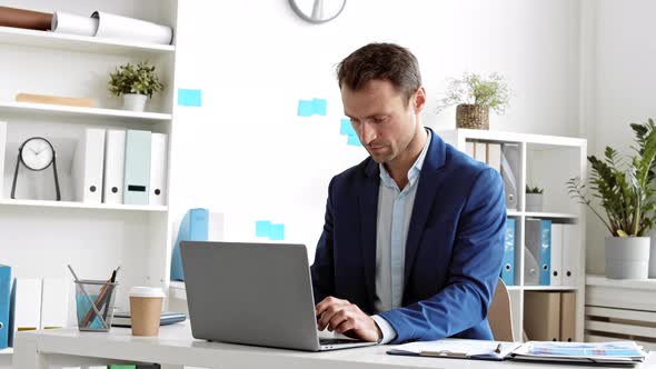 Businessman Working on Laptop alt