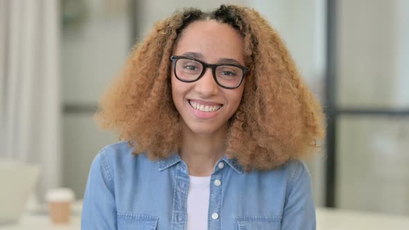 Portrait of Attractive African Woman Smiling Towards Camera alt