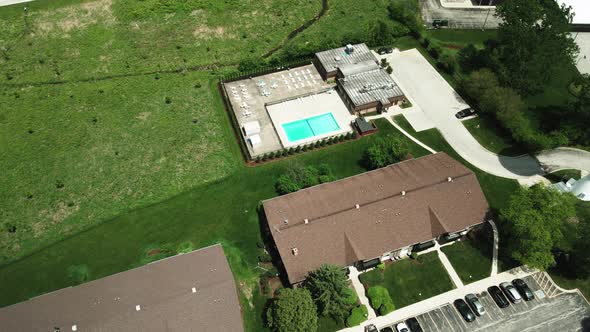 swimming pool of a complex apartments aeria view in Willowbrook Ilinois, USA 4k alt