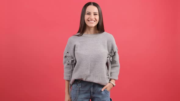 Beautiful Young Woman Doing Talking on the Telephone Gesture. alt