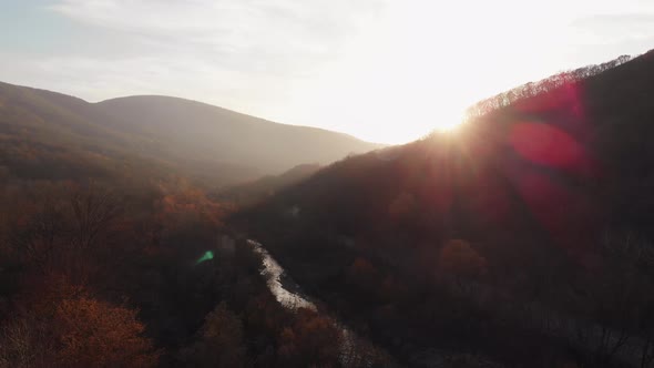 Autumn Landscape Aerial View. A Ray of Sun Comes From the Mountains at Sunset or Dawn