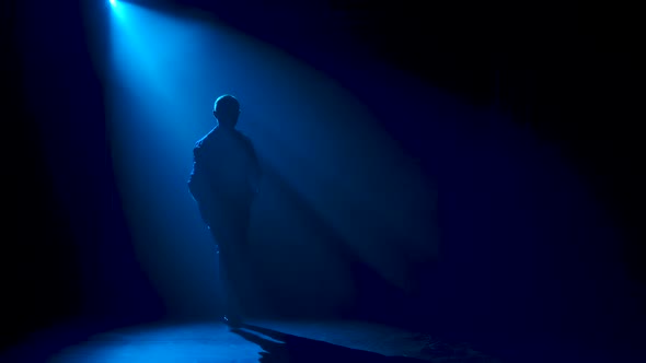 Man Dancing Latin Music. Bachata, Merengue, Salsa. Shot in a Dark Studio with Neon Lights in the alt