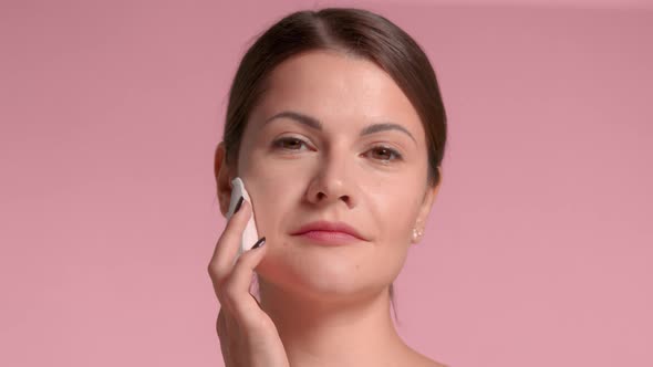 Woman with Peeling Pads Facial Treatment