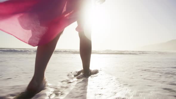 Female Tourist on Summer Vacation in Malibu California USA Woman in Pink Dress alt