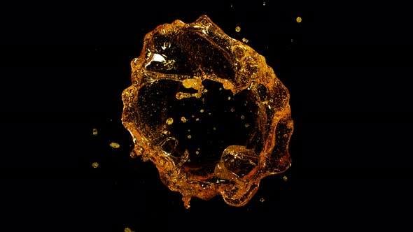 Super Slow Motion Shot of Rotating Oil Whirl Isolated on Black Background at 1000Fps alt