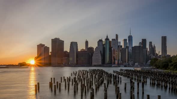 Day to Night POV Timelapse Sunset Over East River Lower Manhattan Skyline with 911 tribute light tur
