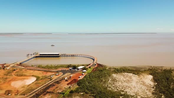 Forward flying drone shot showing Derby Port and Jetty in Western Australia. alt