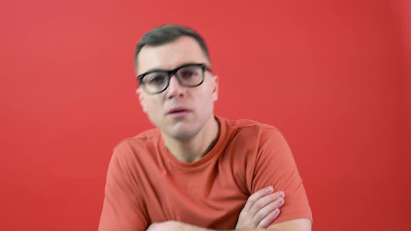 A Man in Glasses Looks Into the Camera As If He Can't See Well alt