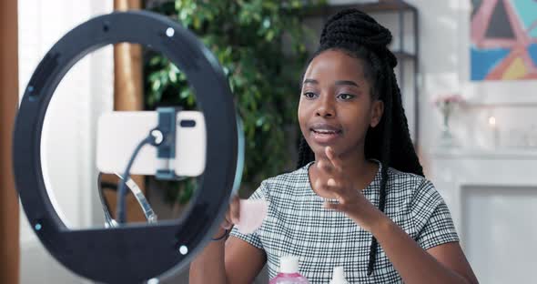 Beauty Influencer Hosts a Live Streaming Channel with Skin Care Tricks alt