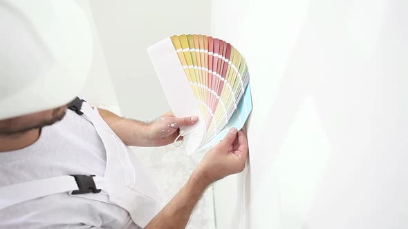 painter man at work choice color with swatches samples