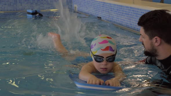Rehabilitation Centre Evexia, swimming lesson, small boy and teacher in swimming pool alt
