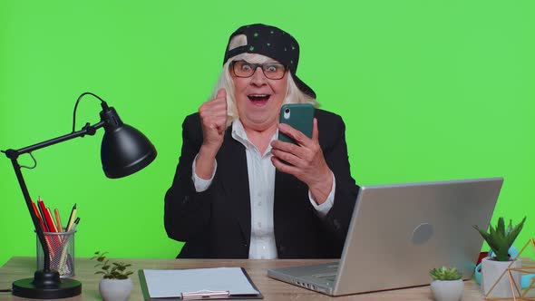 Happy Senior Business Woman Use Smartphone Great Big Win Good News Shocked By Sudden Victory Wow alt