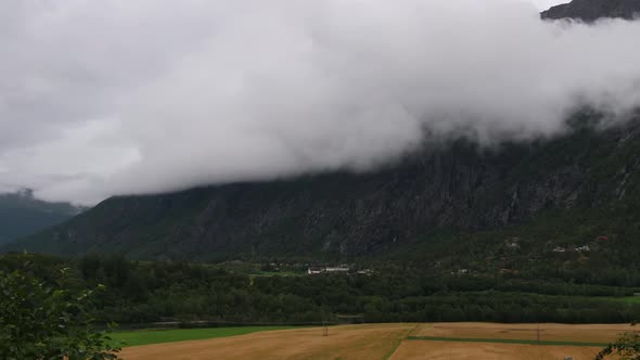 Time-lapse sequence of low clouds over a valley near Trollstigen Road in Norway alt