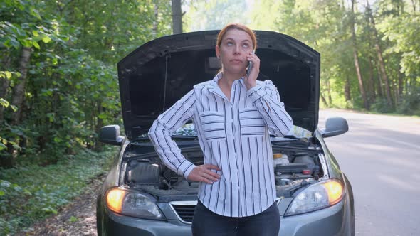 Business Woman at the Background of Broken Car in the Forest alt