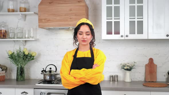 Portrait Serious Housewife Crossing Hands Looking Camera in Home Modern Kitchen alt