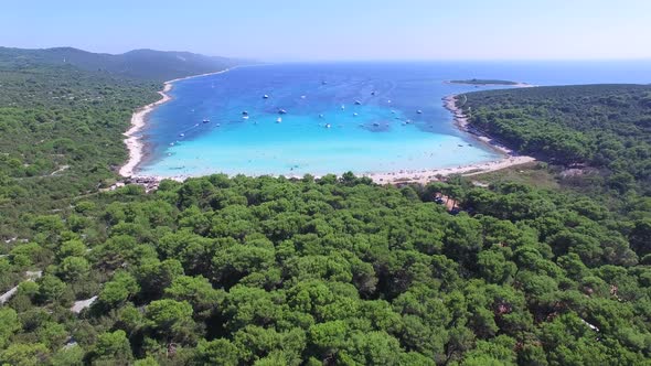 Flying over a lagoon on a sunny island alt