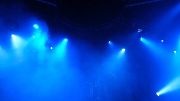 Stage lighting beams spotlight and smoke
