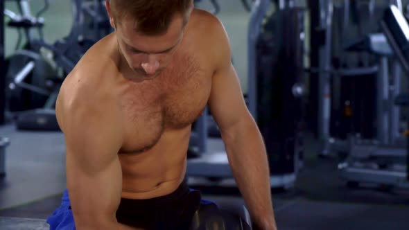 Man Does Curls with Dumbbell alt
