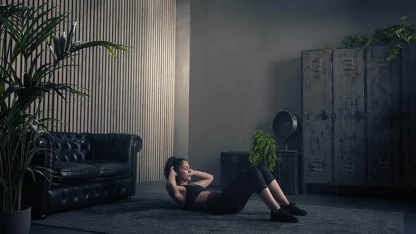 Sporty Young Attractive Woman in Sportswear Practicing Abdominal Crunches, Rock Press Exercise at alt
