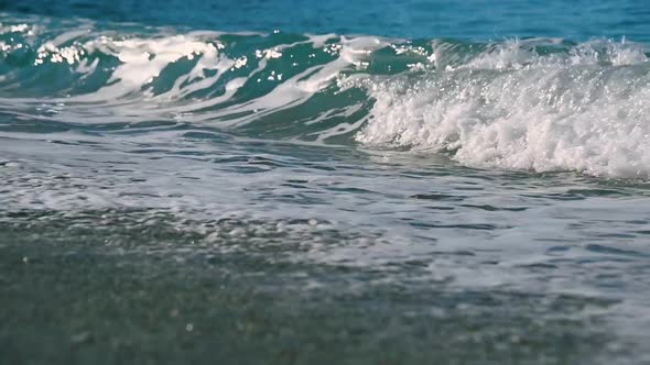 Sparkling Fresh Wavy Water is Shining on a Sunny Summer Day in Slow Motion