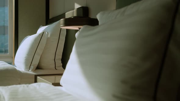 close up white beige soft pillows on bed and blanket bedroom i alt