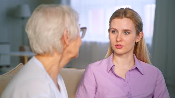 Serious old woman with short grey hair puts alt