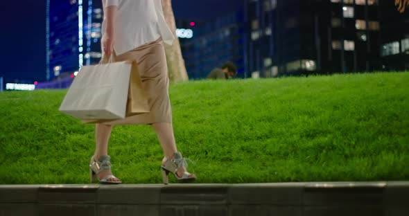 Slow Motion  Shopping Bags, Fashionable Modern Shoes and Silk Skirt in Park alt