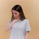 Young Woman Over Beige Background is Coughing - VideoHive Item for Sale